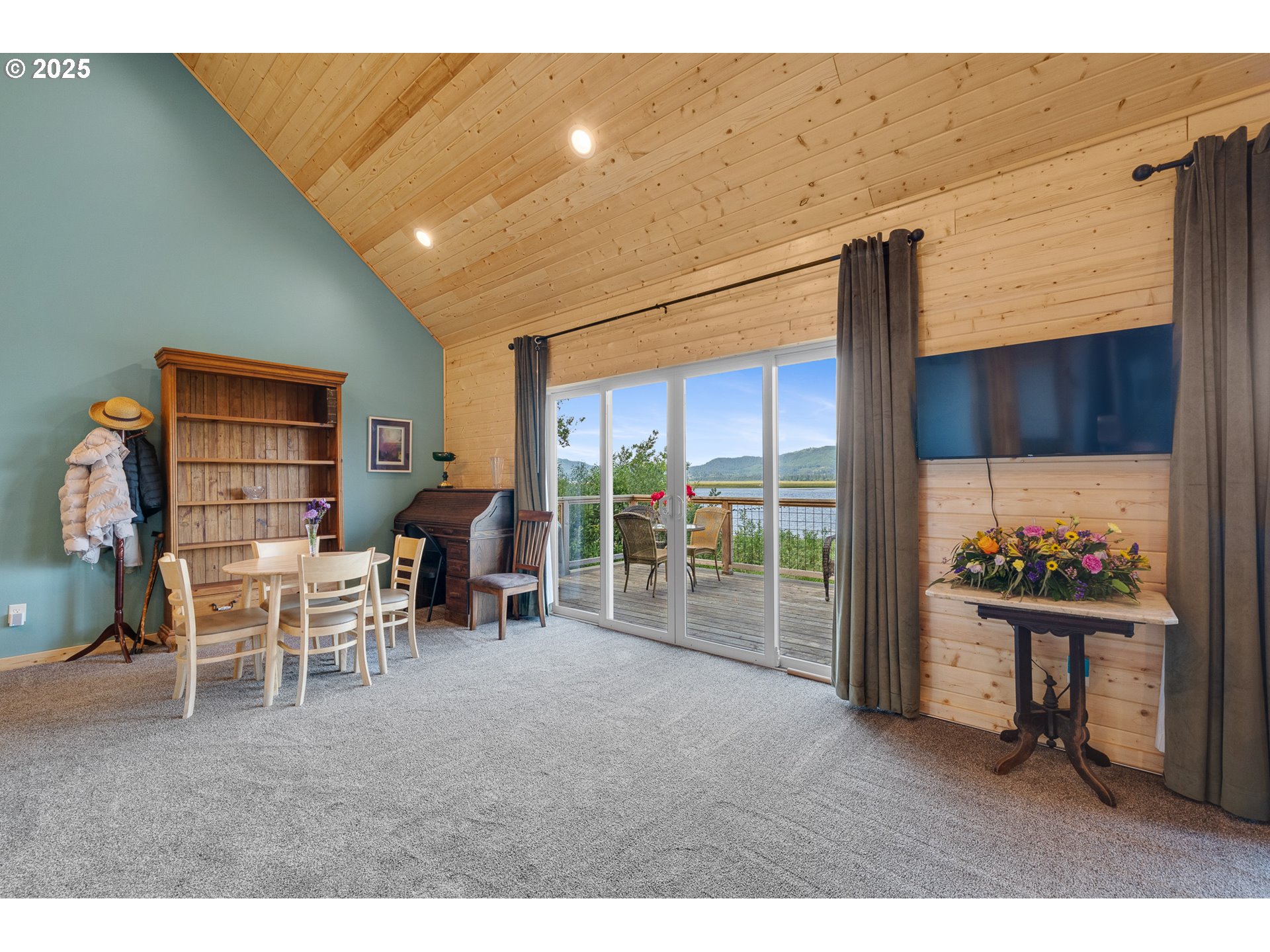 2375 Bayocean Road Northwest Tillamook, OR 97141 - Photo 17 of 37 a living room with furniture a rug and a large window