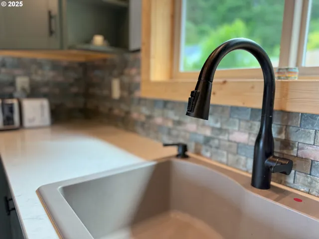 a view of kitchen with furniture and wooden floor