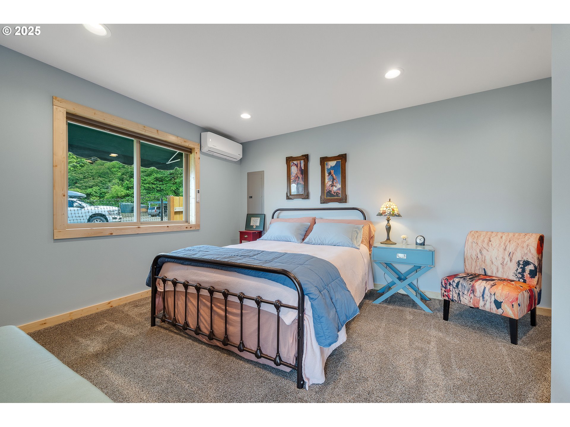 2375 Bayocean Road Northwest Tillamook, OR 97141 - Photo 9 of 37 a bedroom with a bed window and a night stand