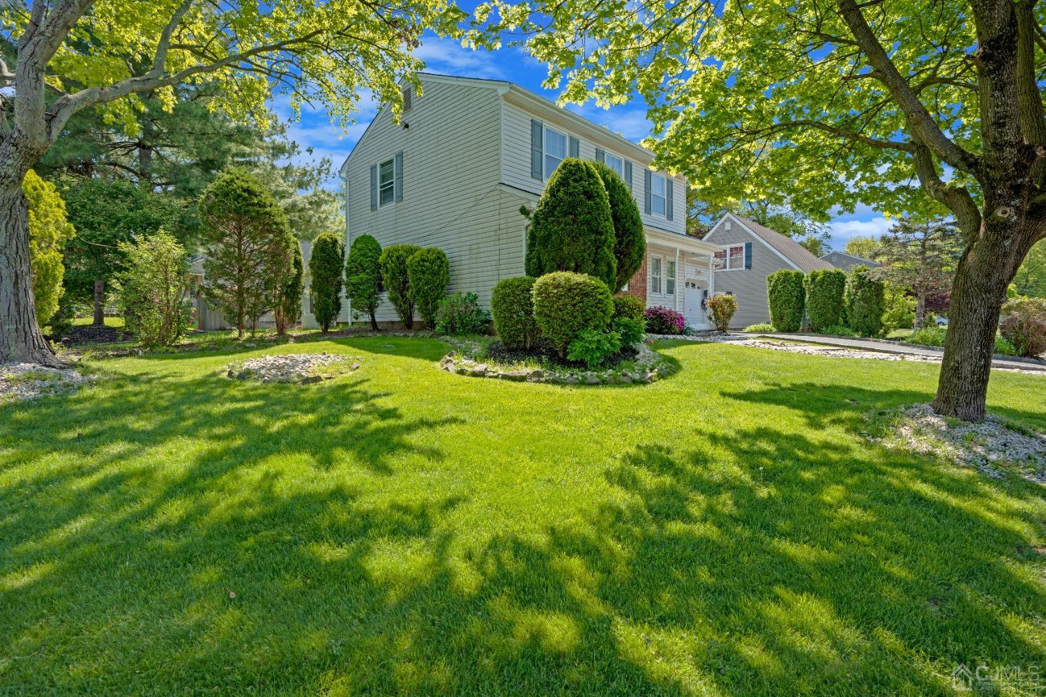 8 Farrington Street Edison, NJ 08820 - Photo 3 of 36 a view of a house with a yard and plants