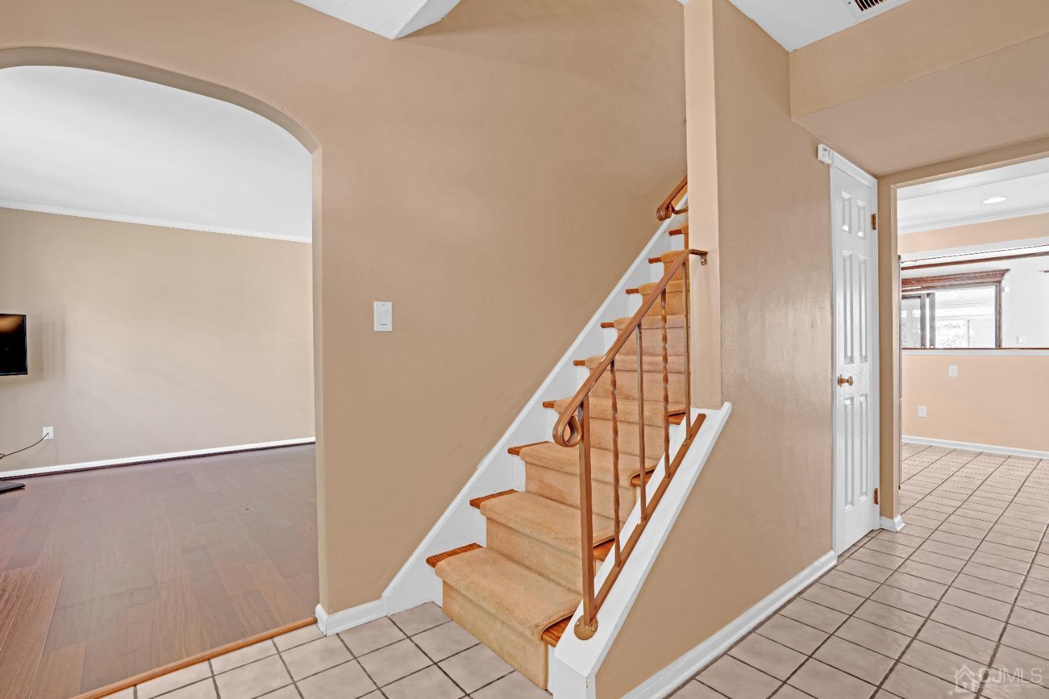 8 Farrington Street Edison, NJ 08820 - Photo 5 of 36 a view of staircase with white walls and railing