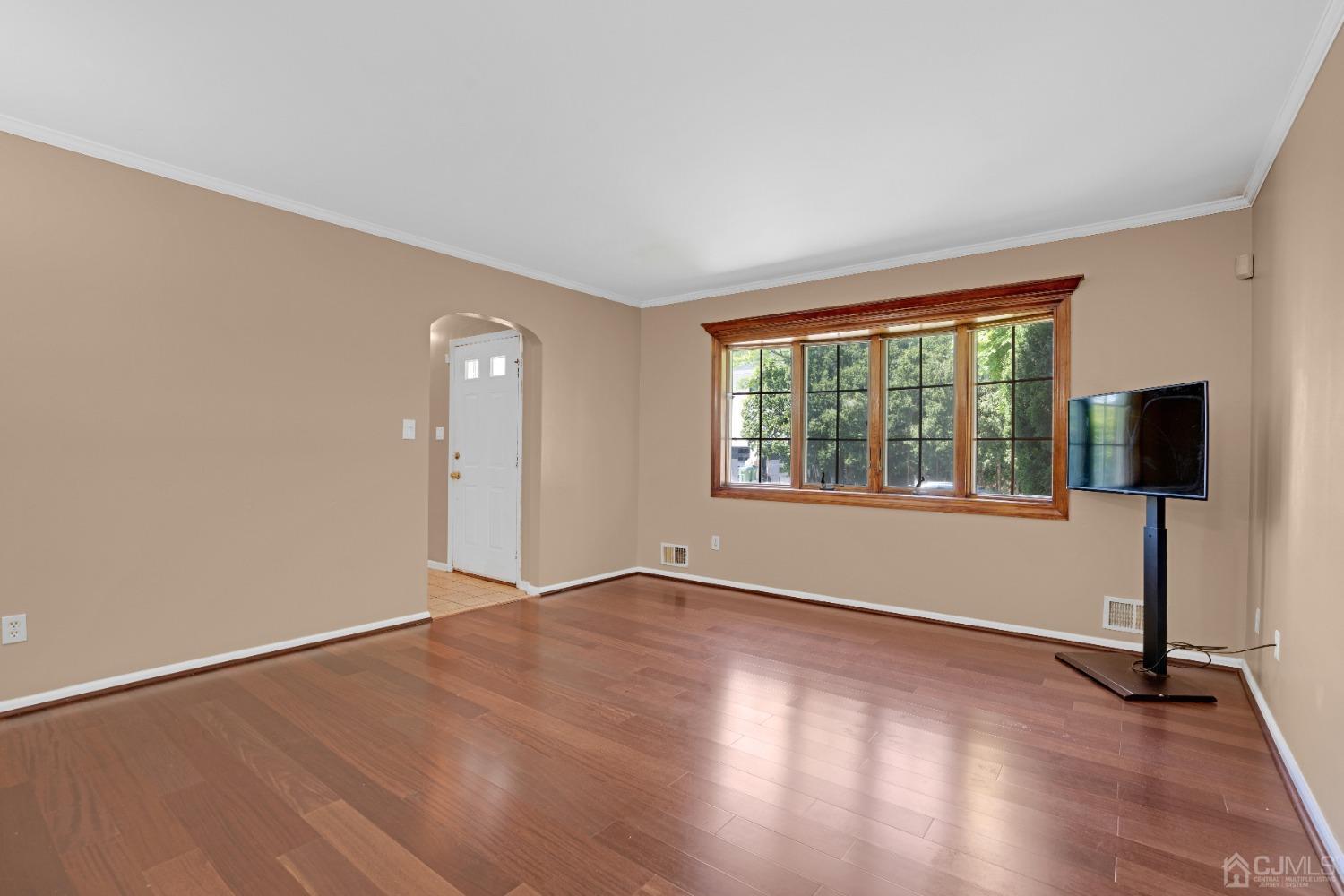 8 Farrington Street Edison, NJ 08820 - Photo 8 of 36 an empty room with wooden floor and windows