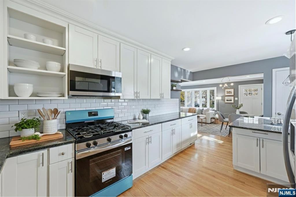 1210 Field Avenue Plainfield, NJ 07060 - Photo 6 of 25 a kitchen with stainless steel appliances a stove sink and cabinets