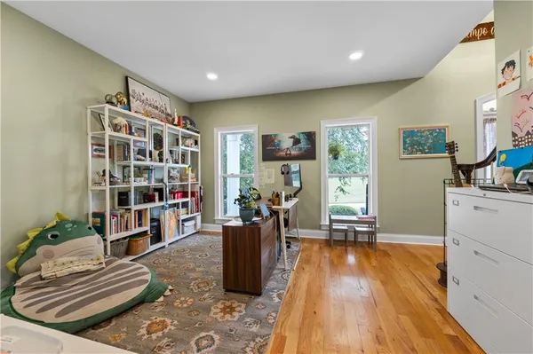 a living room with furniture fireplace and flat screen tv