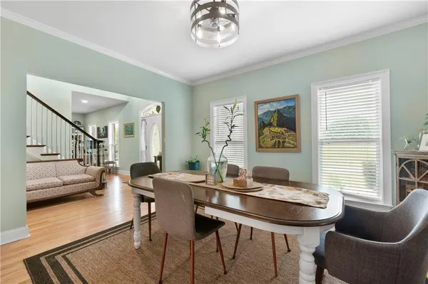 a kitchen with stainless steel appliances white cabinets and a refrigerator