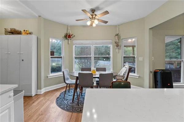 a view of room with window and ceiling fan