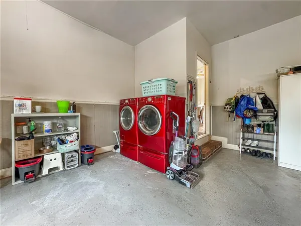 a view of a room with a window and a ceiling fan