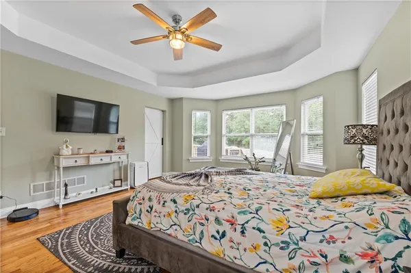 a bed room with a bed and a chandelier