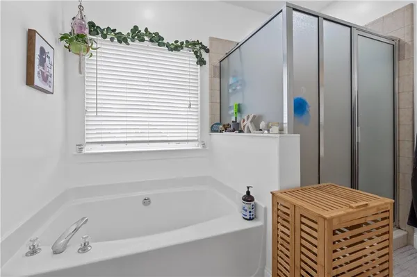 a bathroom with a sink a mirror and a shower