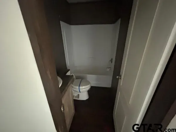 a bathroom with a sink and toilet
