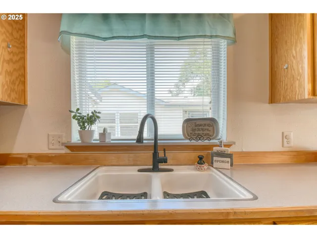 a view of kitchen sink and window