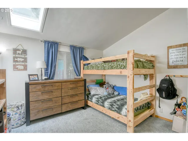 a view of bedroom with furniture and toys