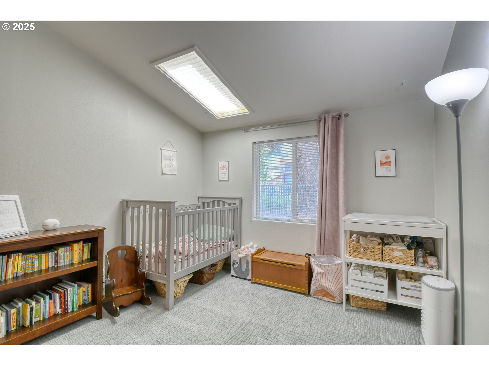 216 East Washington Street Athena, OR 97813 - Photo 17 of 27 a living room with furniture a window and a book shelf