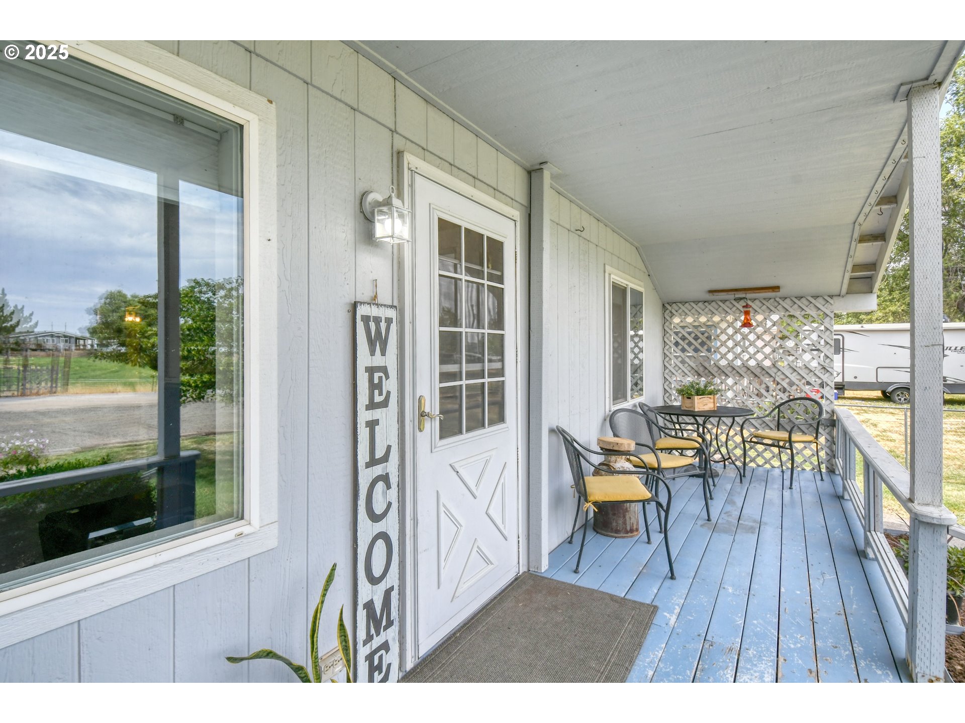 216 East Washington Street Athena, OR 97813 - Photo 2 of 27 a balcony with wooden floor and outdoor space