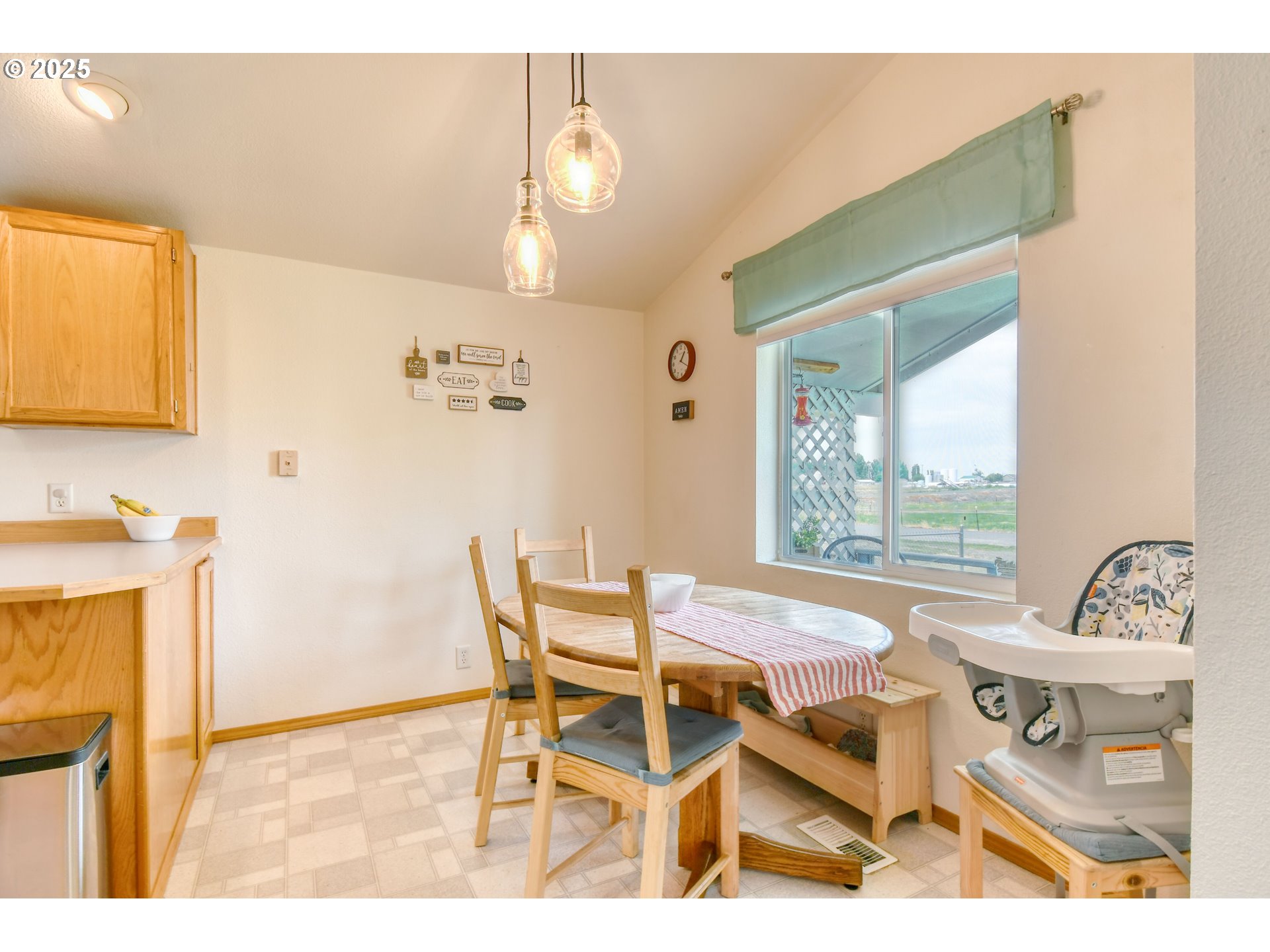 216 East Washington Street Athena, OR 97813 - Photo 7 of 27 a view of a dining room with furniture and a window