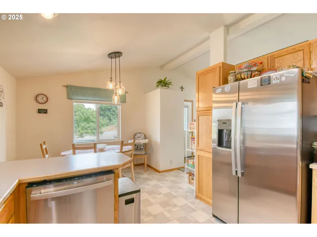 a kitchen with a refrigerator and a sink