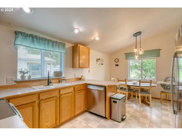 a kitchen with lots of counter top space and dining table