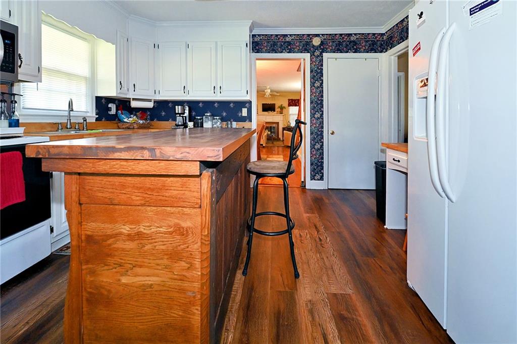 5937 Thompson Bridge Road Murrayville, GA 30564 - Photo 13 of 54 a view of a kitchen with furniture and wooden floor