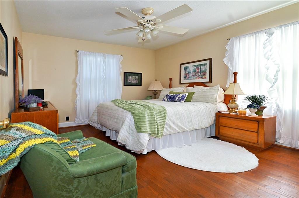 5937 Thompson Bridge Road Murrayville, GA 30564 - Photo 23 of 54 a bedroom with two beds and a chair