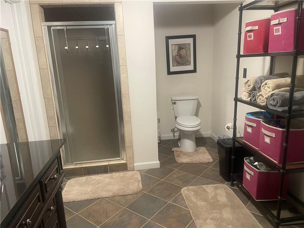 5937 Thompson Bridge Road Murrayville, GA 30564 - Photo 27 of 54 a bathroom with a toilet