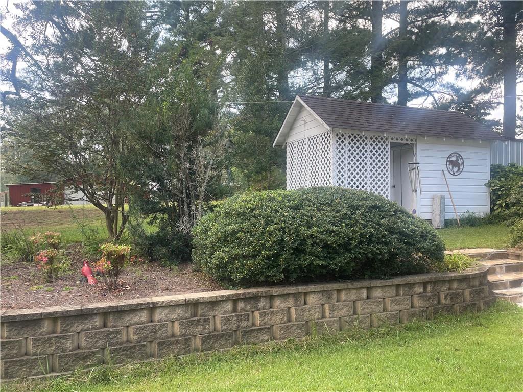 5937 Thompson Bridge Road Murrayville, GA 30564 - Photo 35 of 54 a view of a house with a yard