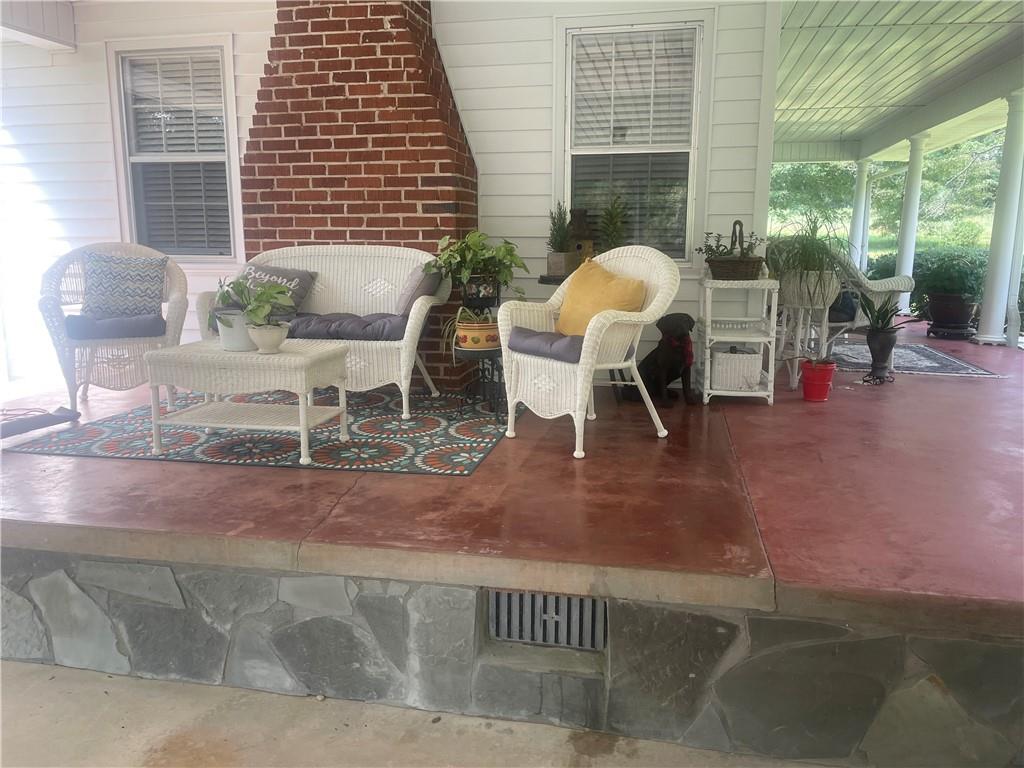 5937 Thompson Bridge Road Murrayville, GA 30564 - Photo 7 of 54 a dining room with furniture and a floor to ceiling window
