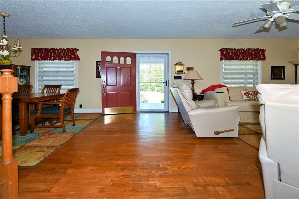 5937 Thompson Bridge Road Murrayville, GA 30564 - Photo 9 of 54 a living room with furniture and a flat screen tv