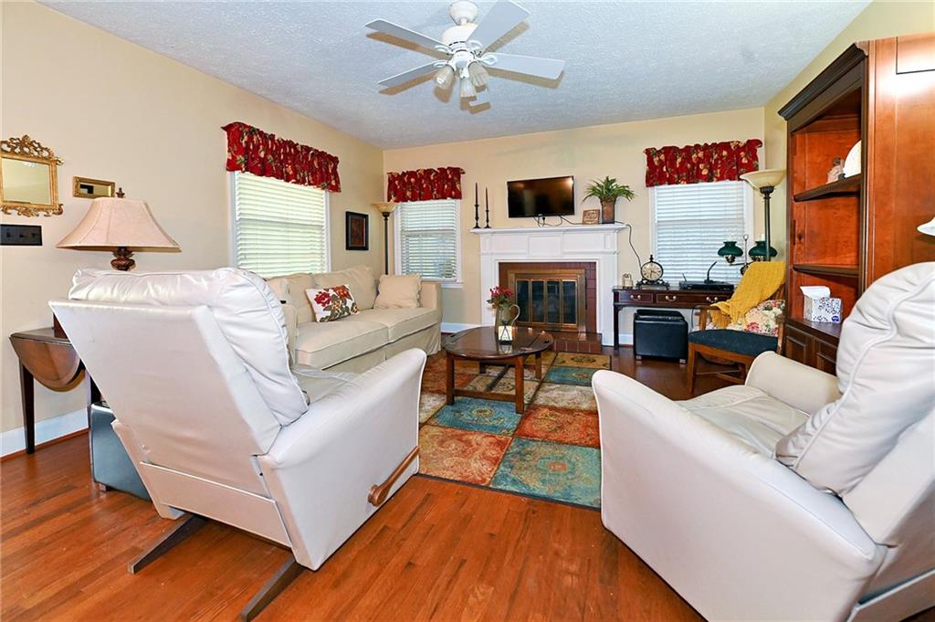 5937 Thompson Bridge Road Murrayville, GA 30564 - Photo 10 of 54 a living room with furniture fireplace and window