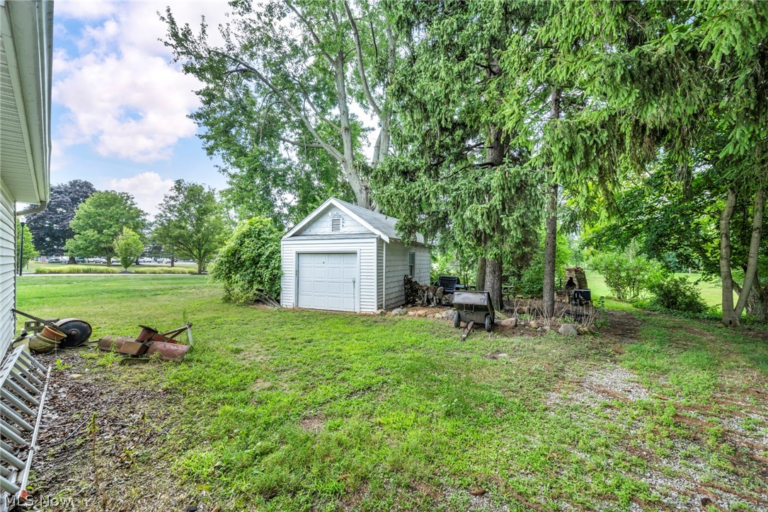 35470 Detroit Road Avon, OH 44011 - Photo 5 of 30 View of yard featuring a garage and an outdoor structure