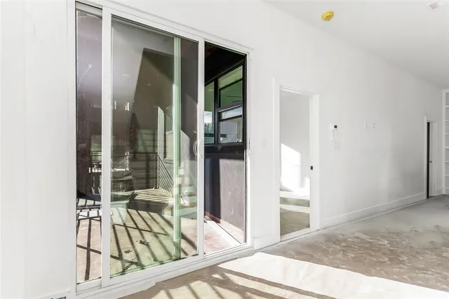 a view of balcony with wooden floor