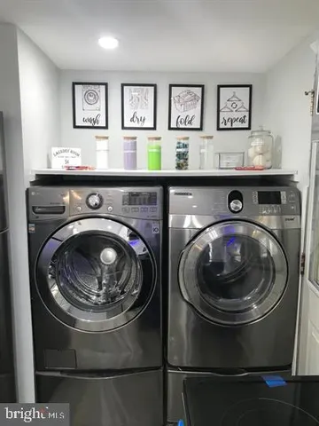 a utility room with dryer and washer