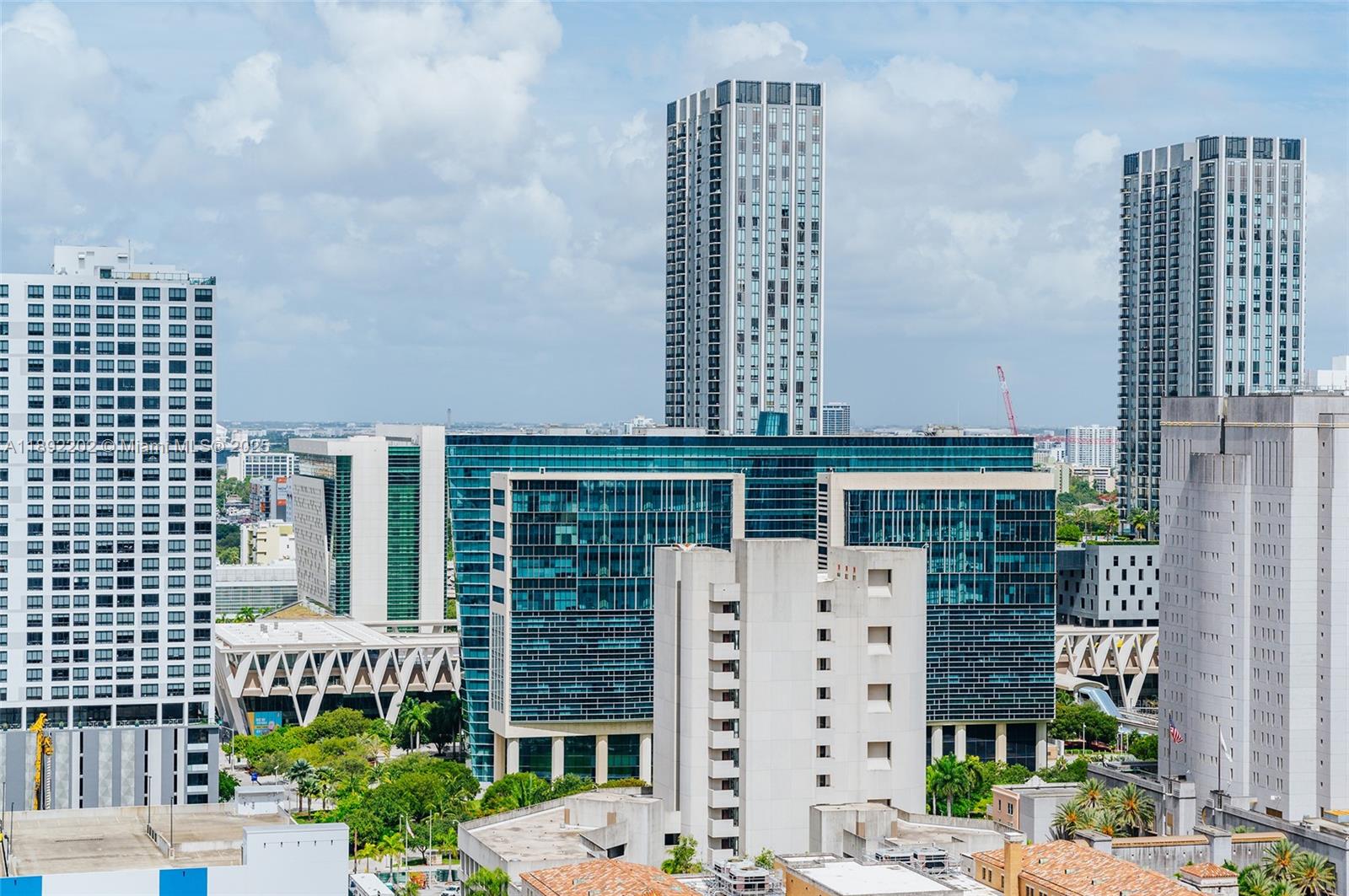 227 Northeast 2nd Street, Unit 2508 Miami, FL 33132 - Photo 15 of 28 a front view of a building with multi story windows
