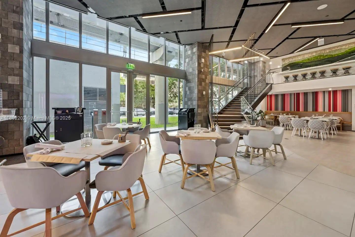 227 Northeast 2nd Street, Unit 2508 Miami, FL 33132 - Photo 18 of 28 a view of a dining room with furniture water and chandelier