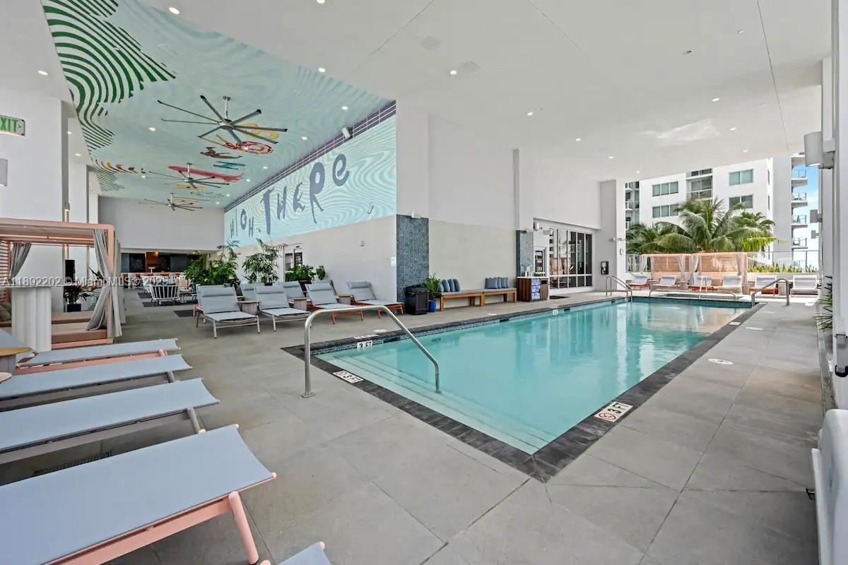 227 Northeast 2nd Street, Unit 2508 Miami, FL 33132 - Photo 28 of 28 a living room with lots of furniture and a view of kitchen