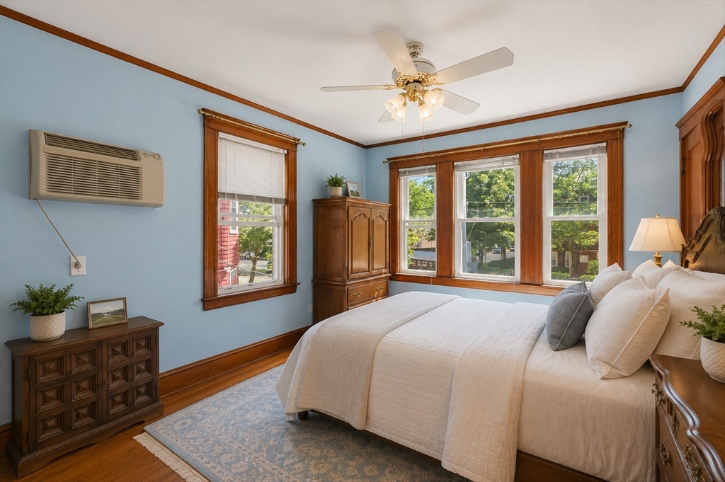 157 Elm Street Somerville, MA 02144 - Photo 9 of 19 a bedroom with a bed and window