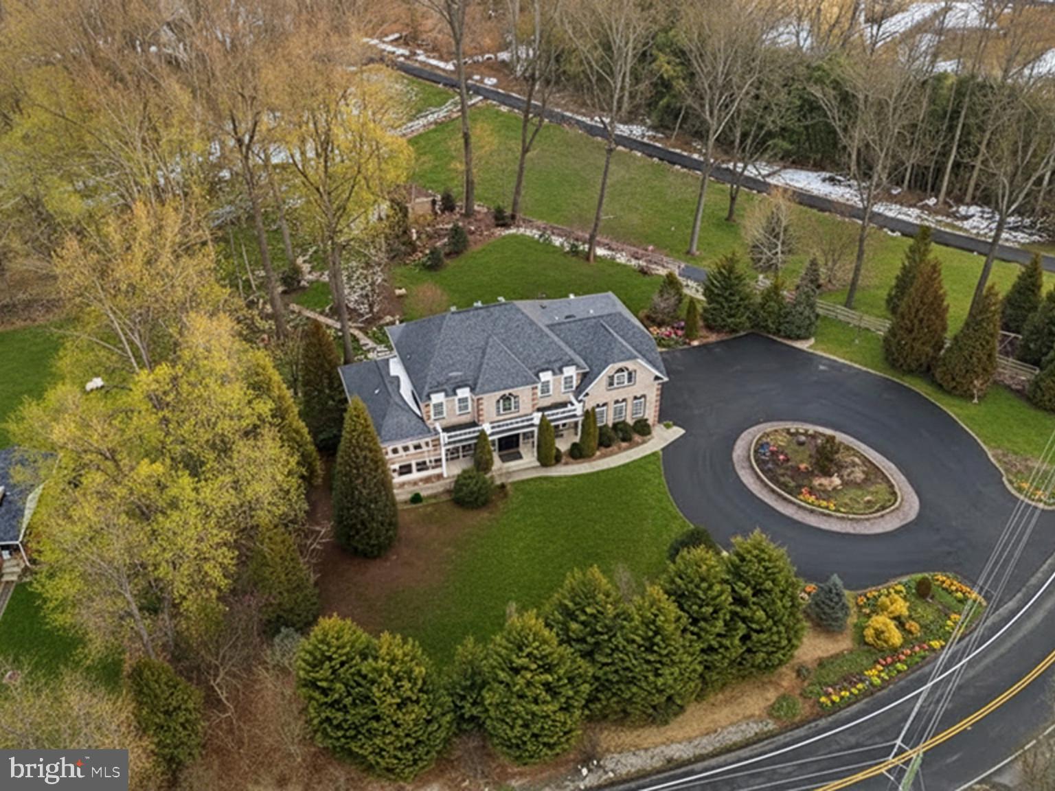 7501 Clifton Road Clifton, VA 20124 - Photo 8 of 93 an aerial view of a house with garden space and a lake view in back