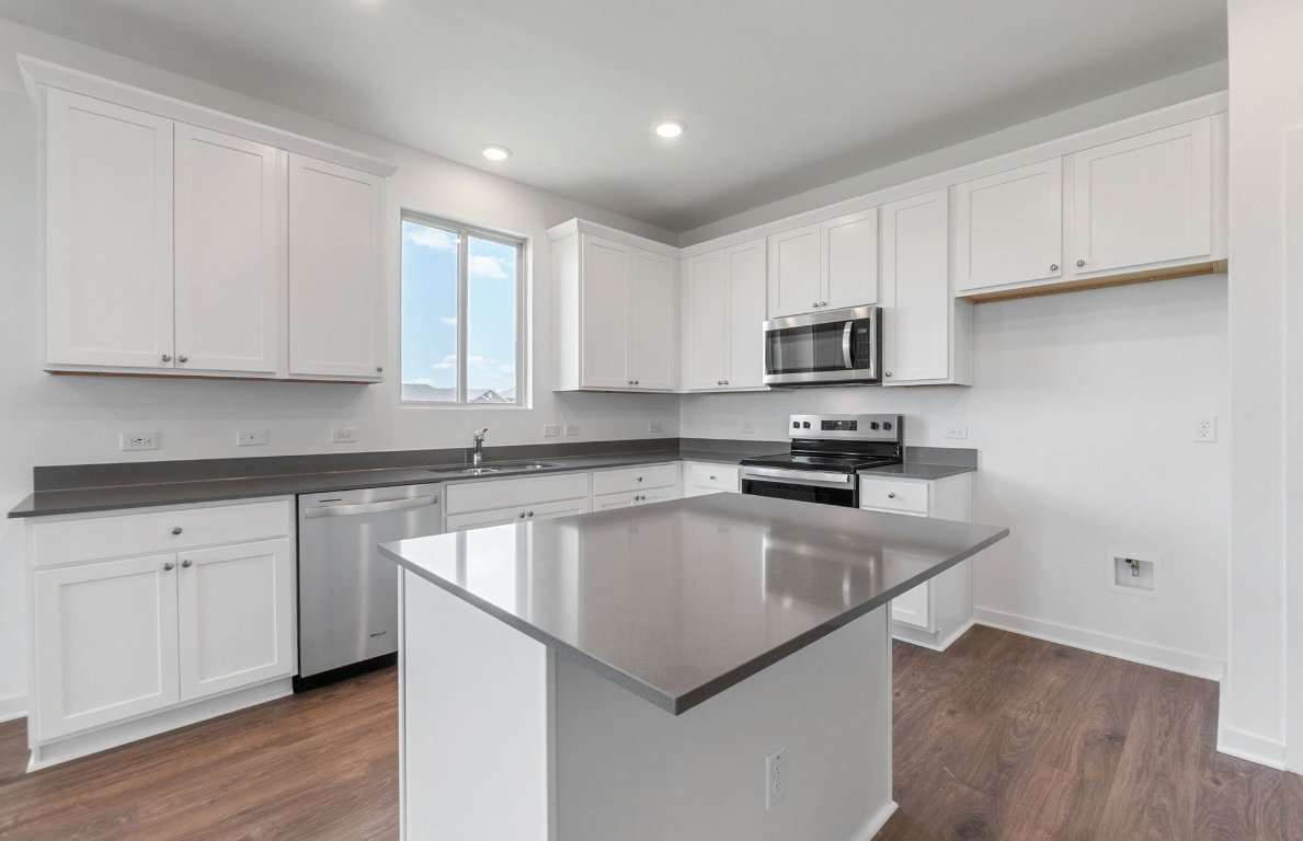 3003 Gillespie Court Temple, TX 76501 - Photo 2 of 17 a kitchen with granite countertop white cabinets and a stainless steel appliances