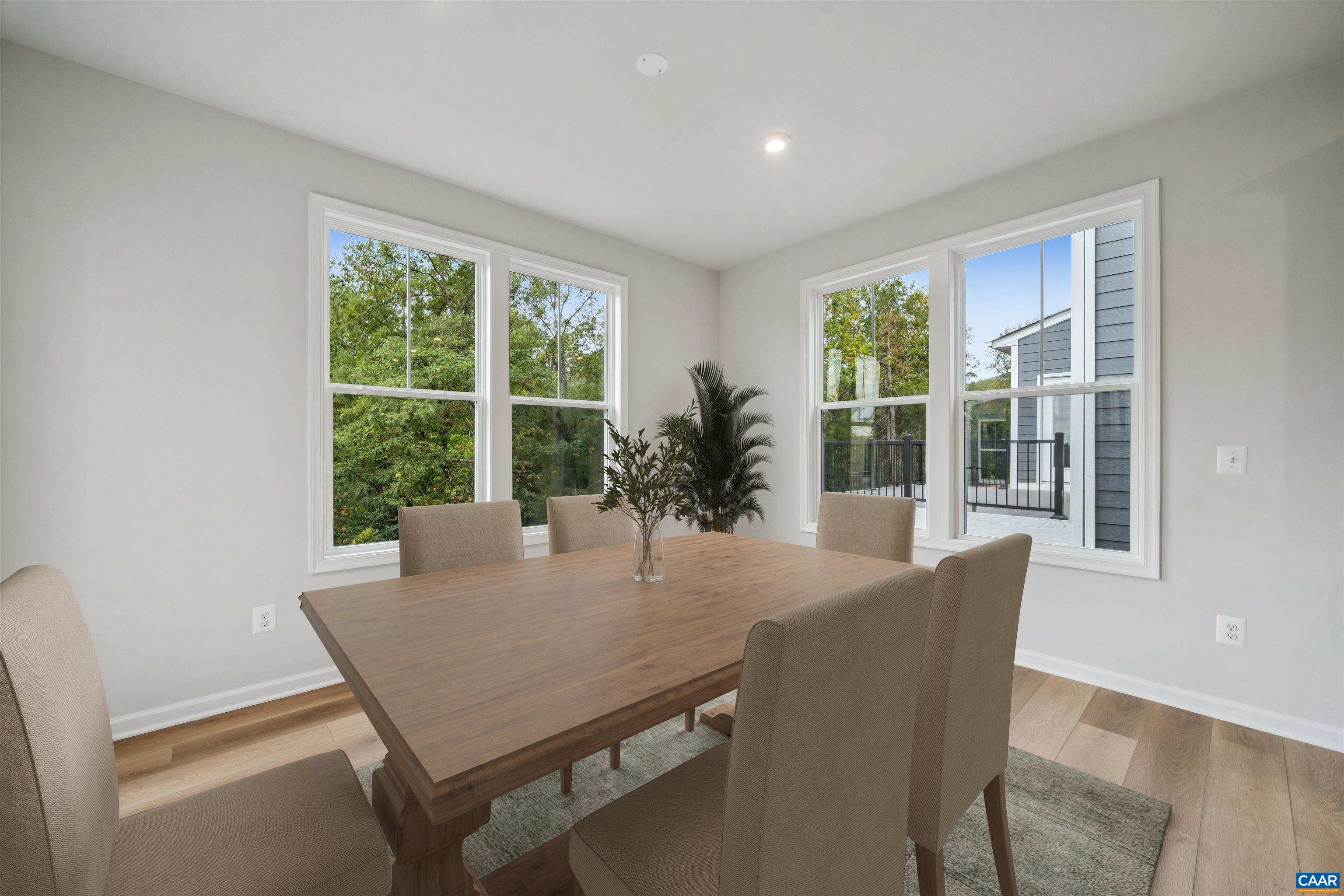 3035 Rambling Brk Lane Crozet, VA 22932 - Photo 12 of 45 a view of a dining room with furniture window and wooden floor