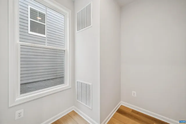 a view of a room that has a window