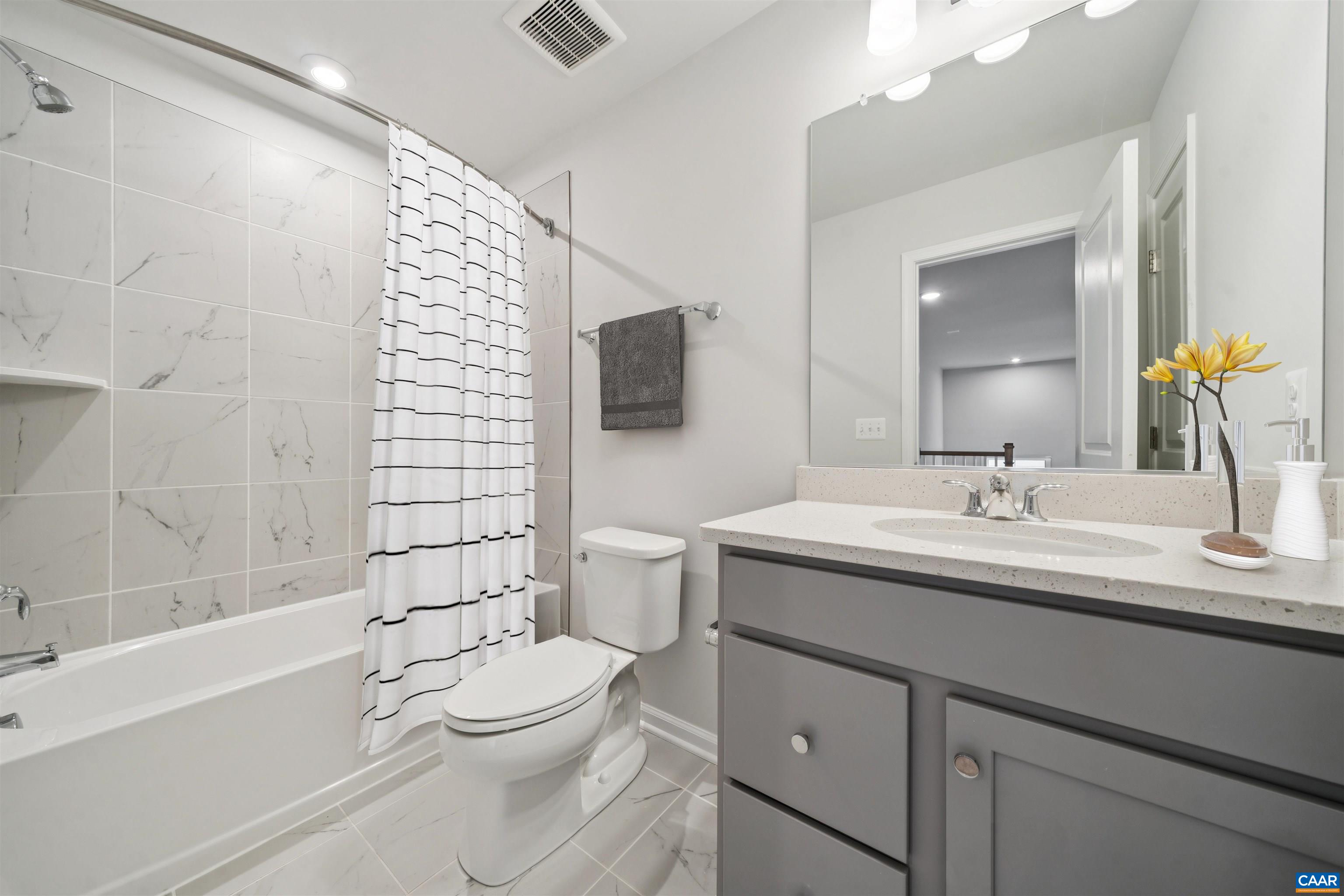 3035 Rambling Brk Lane Crozet, VA 22932 - Photo 26 of 45 a bathroom with a sink a toilet and shower