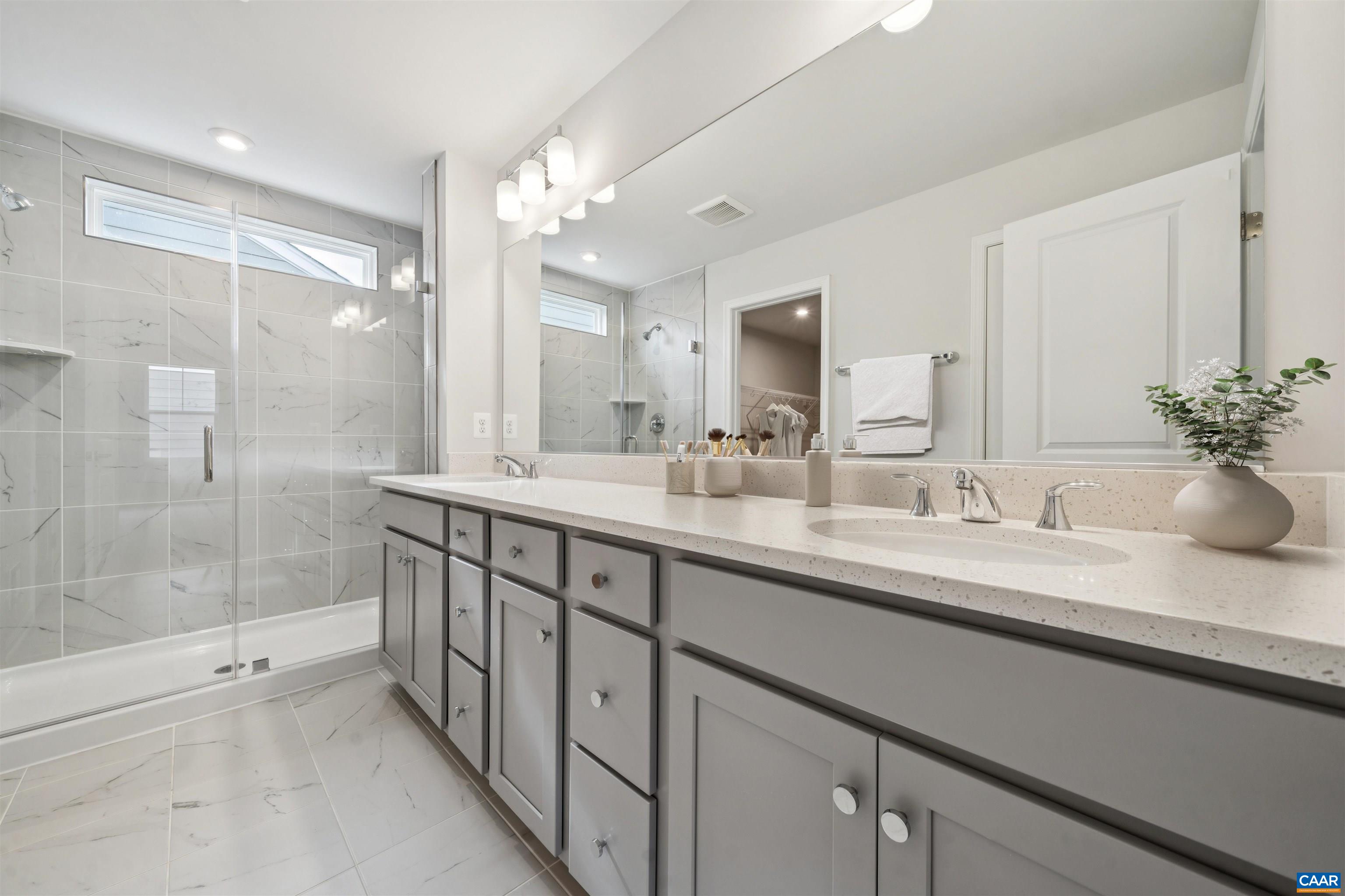 3035 Rambling Brk Lane Crozet, VA 22932 - Photo 30 of 45 a bathroom with double sink and a mirror