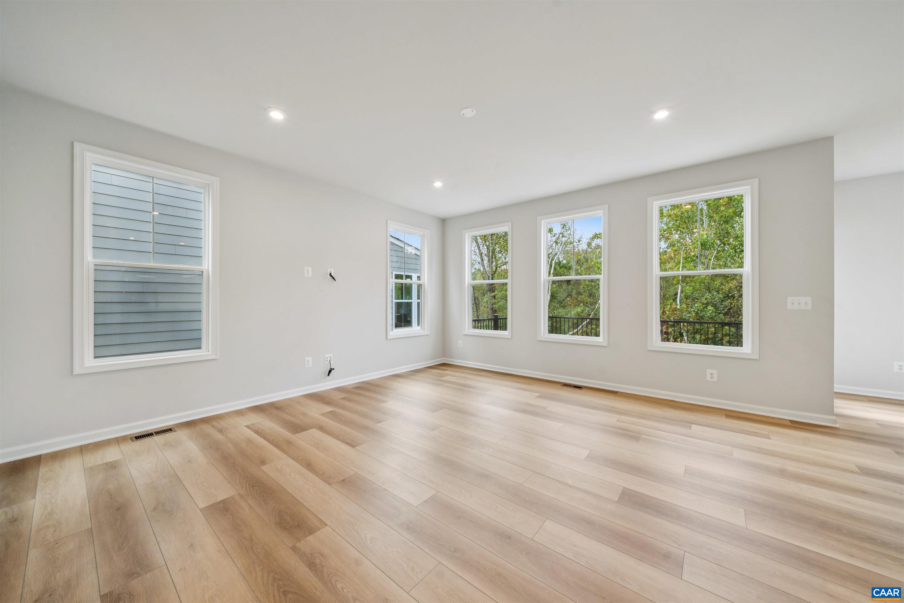 3035 Rambling Brk Lane Crozet, VA 22932 - Photo 7 of 45 a view of an empty room with a window and wooden floor