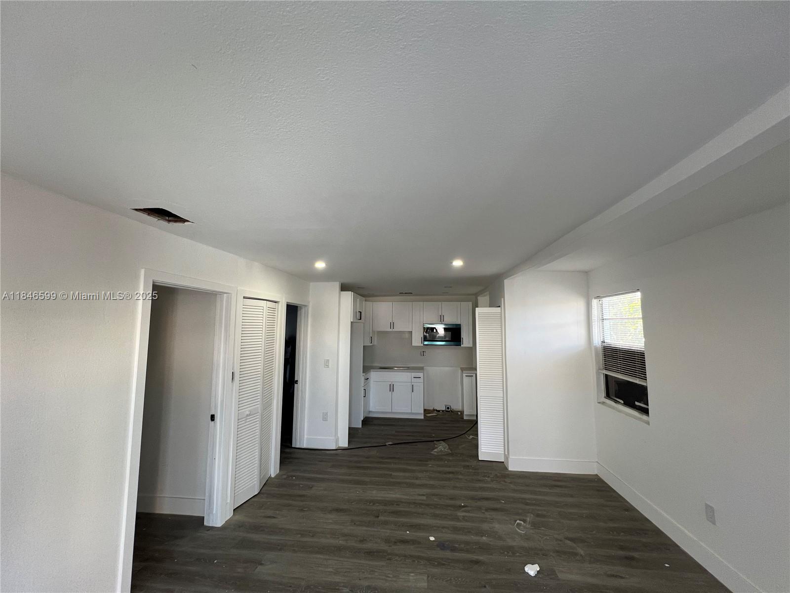 1800 Southwest 3rd Street Miami, FL 33135 - Photo 3 of 17 a view of an empty room with wooden floor