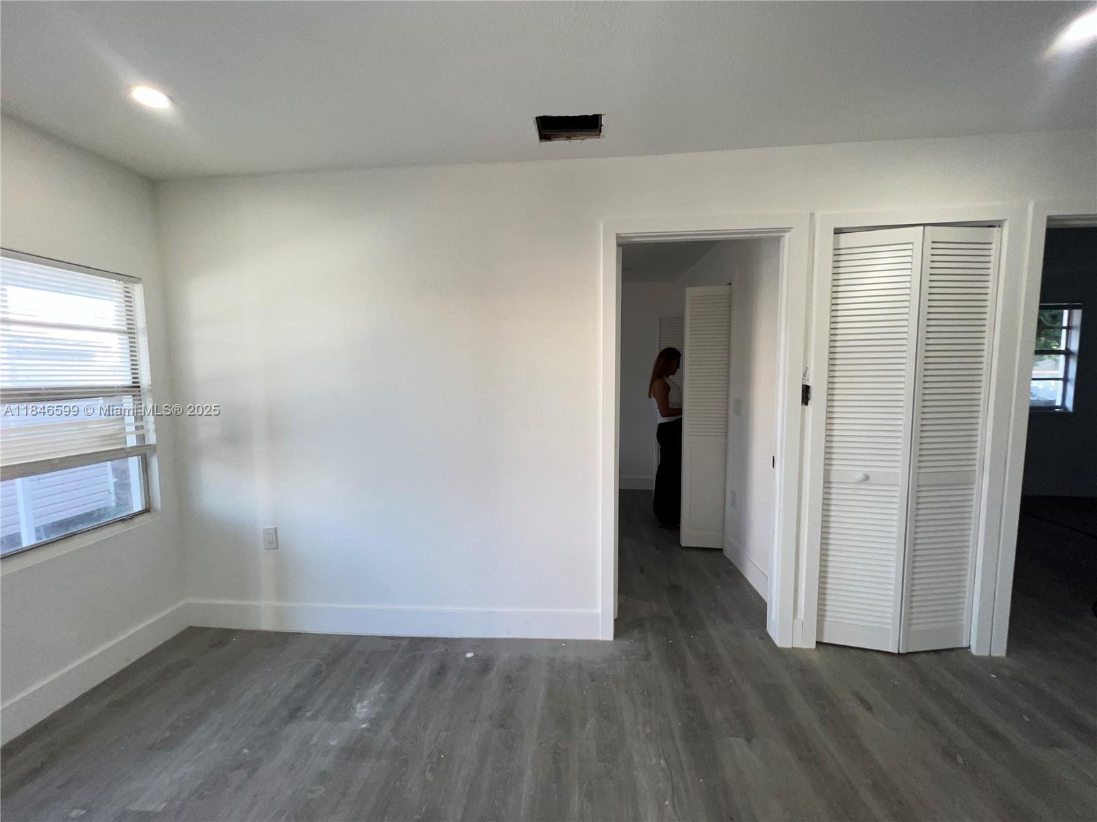 1800 Southwest 3rd Street Miami, FL 33135 - Photo 8 of 17 an empty room with wooden floor and windows