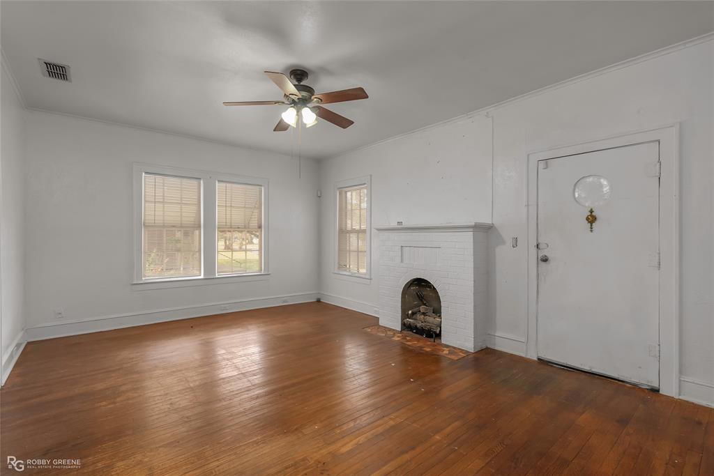 117 Merrick Street Shreveport, LA 71104 - Photo 11 of 25 a view of a livingroom with a fireplace window and wooden floor