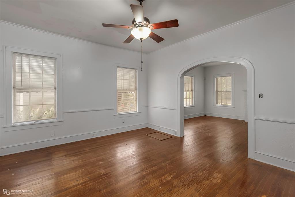 117 Merrick Street Shreveport, LA 71104 - Photo 13 of 25 a view of an empty room with wooden floor and a window