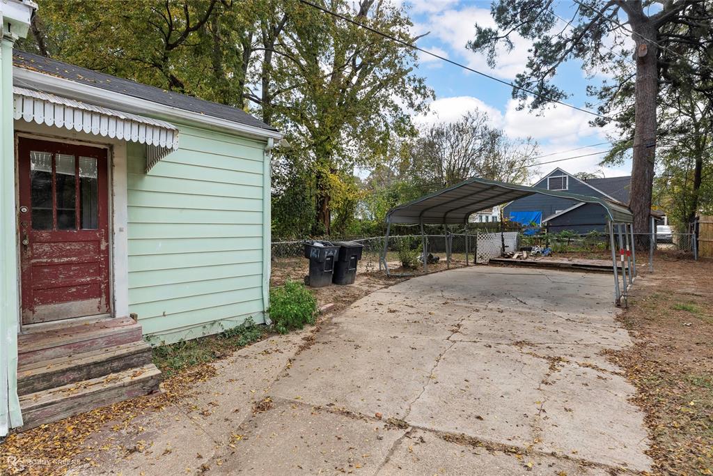 117 Merrick Street Shreveport, LA 71104 - Photo 5 of 25 a view of street with wooden fence