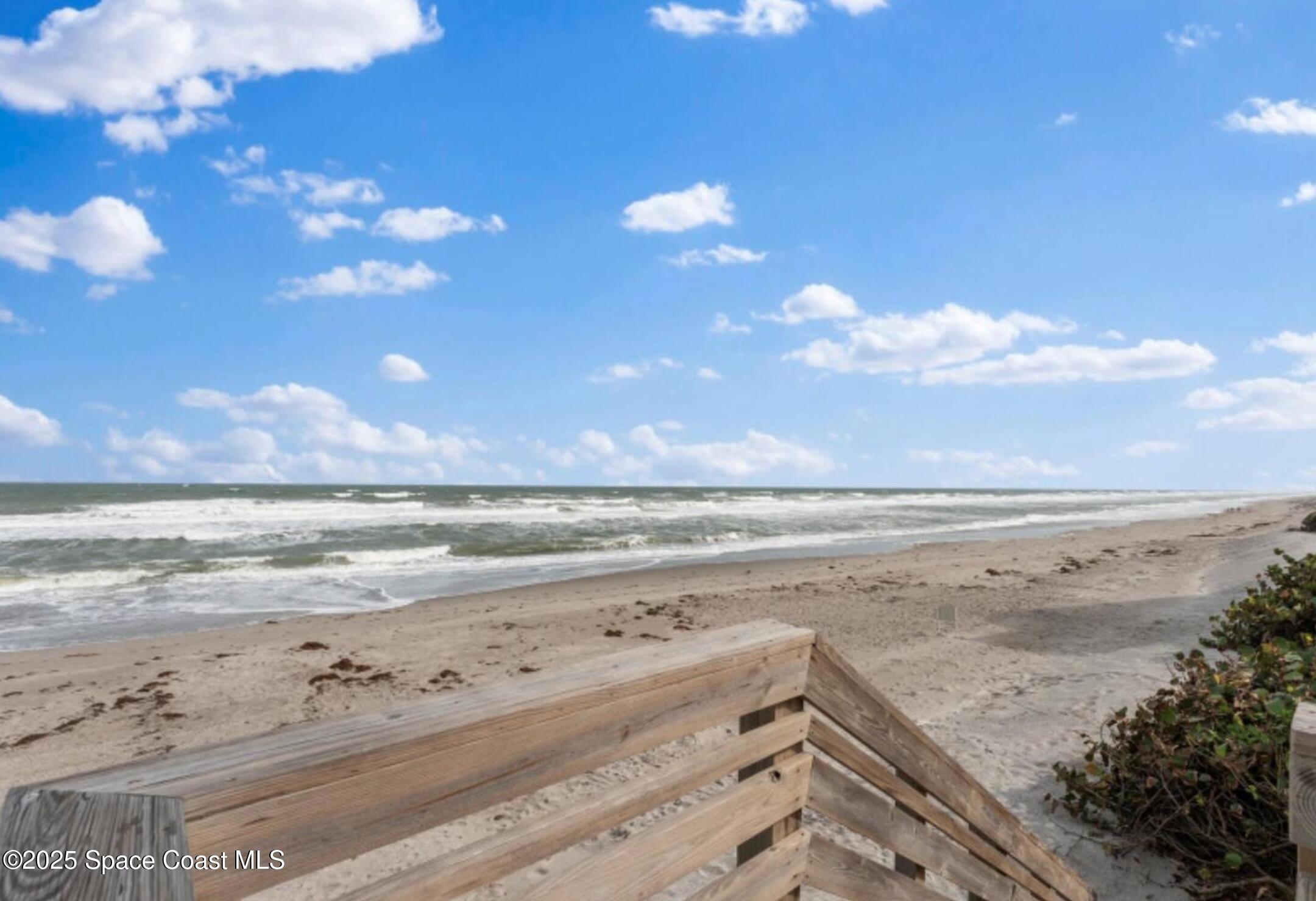 3037 S Highway, Unit 2C Melbourne Beach, FL 32951 - Photo 39 of 48 a view of beach and ocean