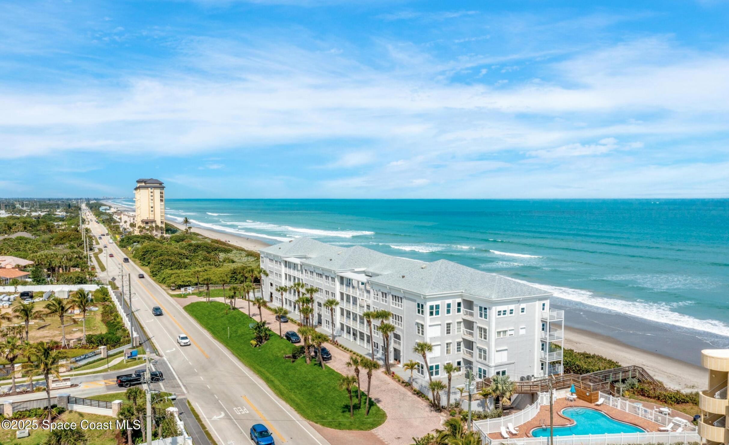 3037 S Highway, Unit 2C Melbourne Beach, FL 32951 - Photo 42 of 48 a view of a city with an ocean view