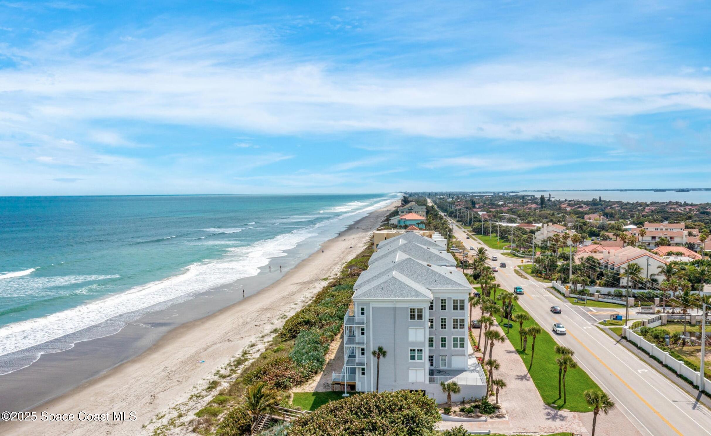 3037 S Highway, Unit 2C Melbourne Beach, FL 32951 - Photo 43 of 48 a view of a city with an ocean view